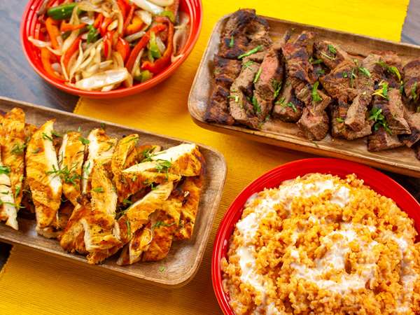 Sliced, marinated chicken and steak for fajitas at Que Onda. 